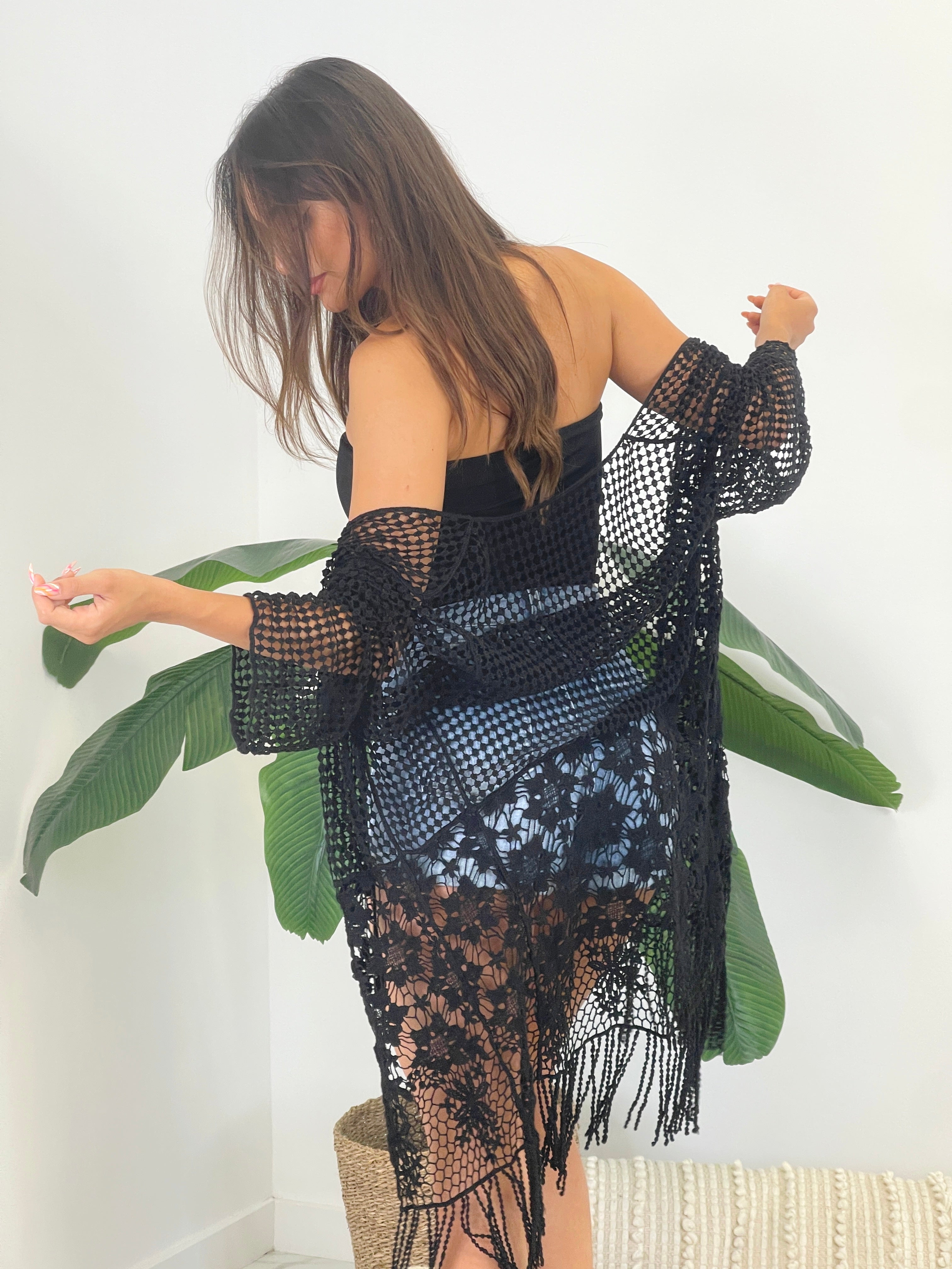 Chaqueta calada con flecos