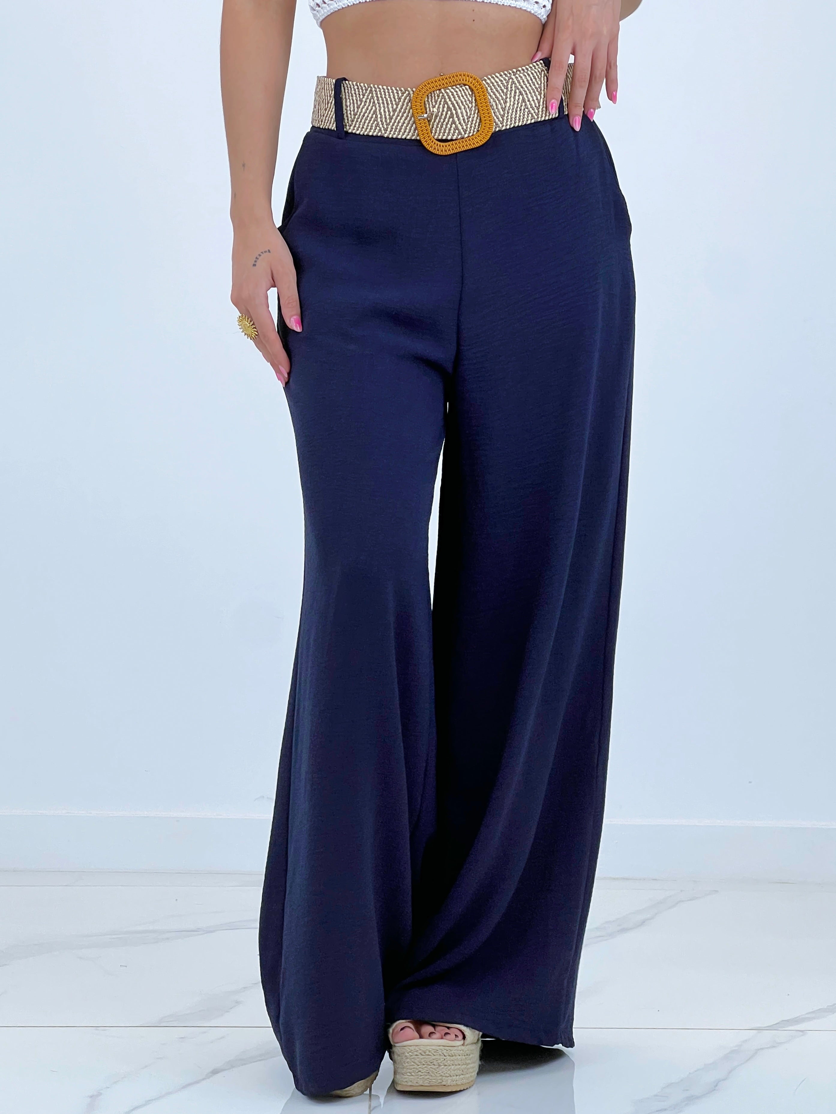 Flowing trousers with raffia belt