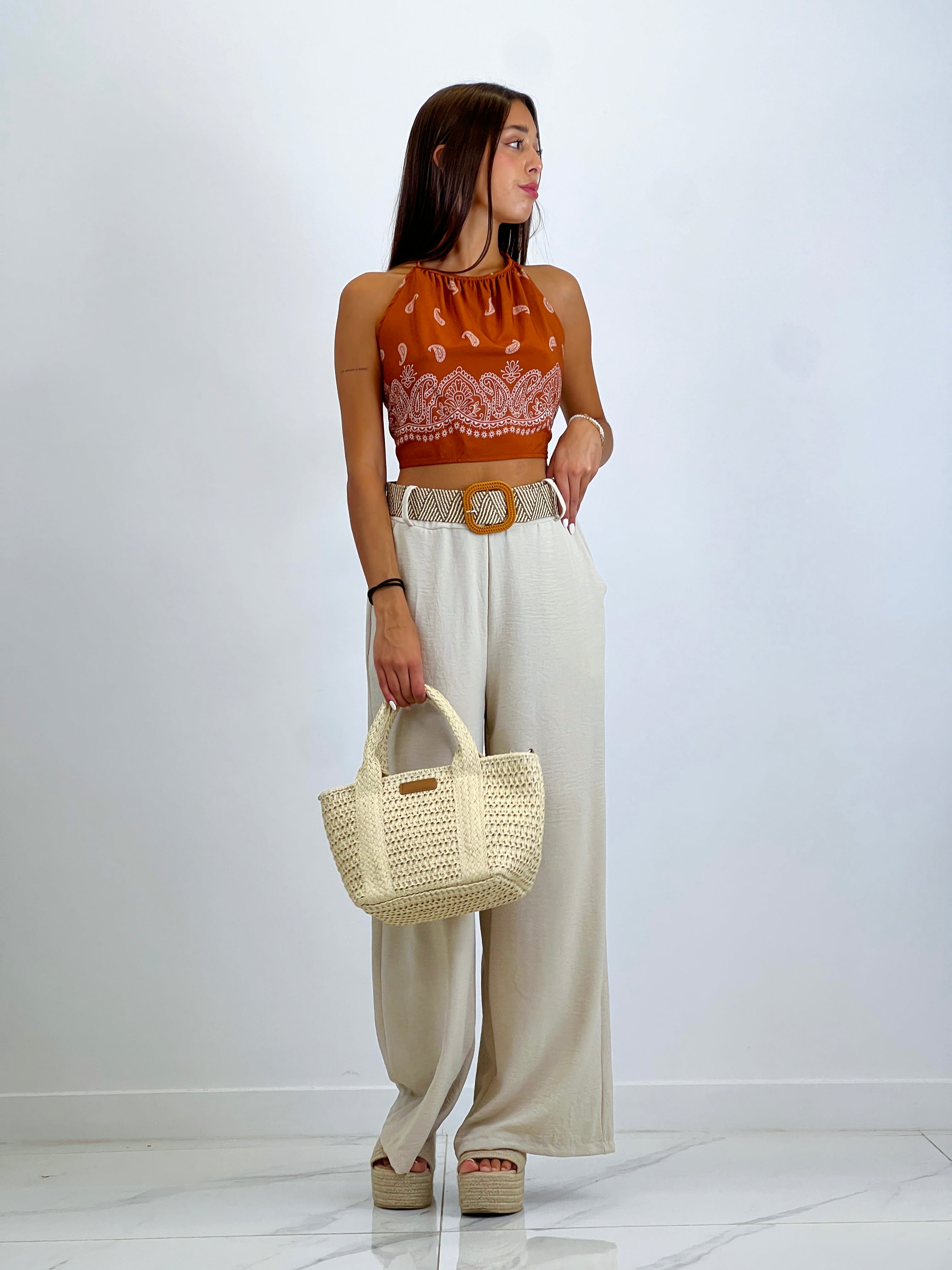 Flowing trousers with raffia belt