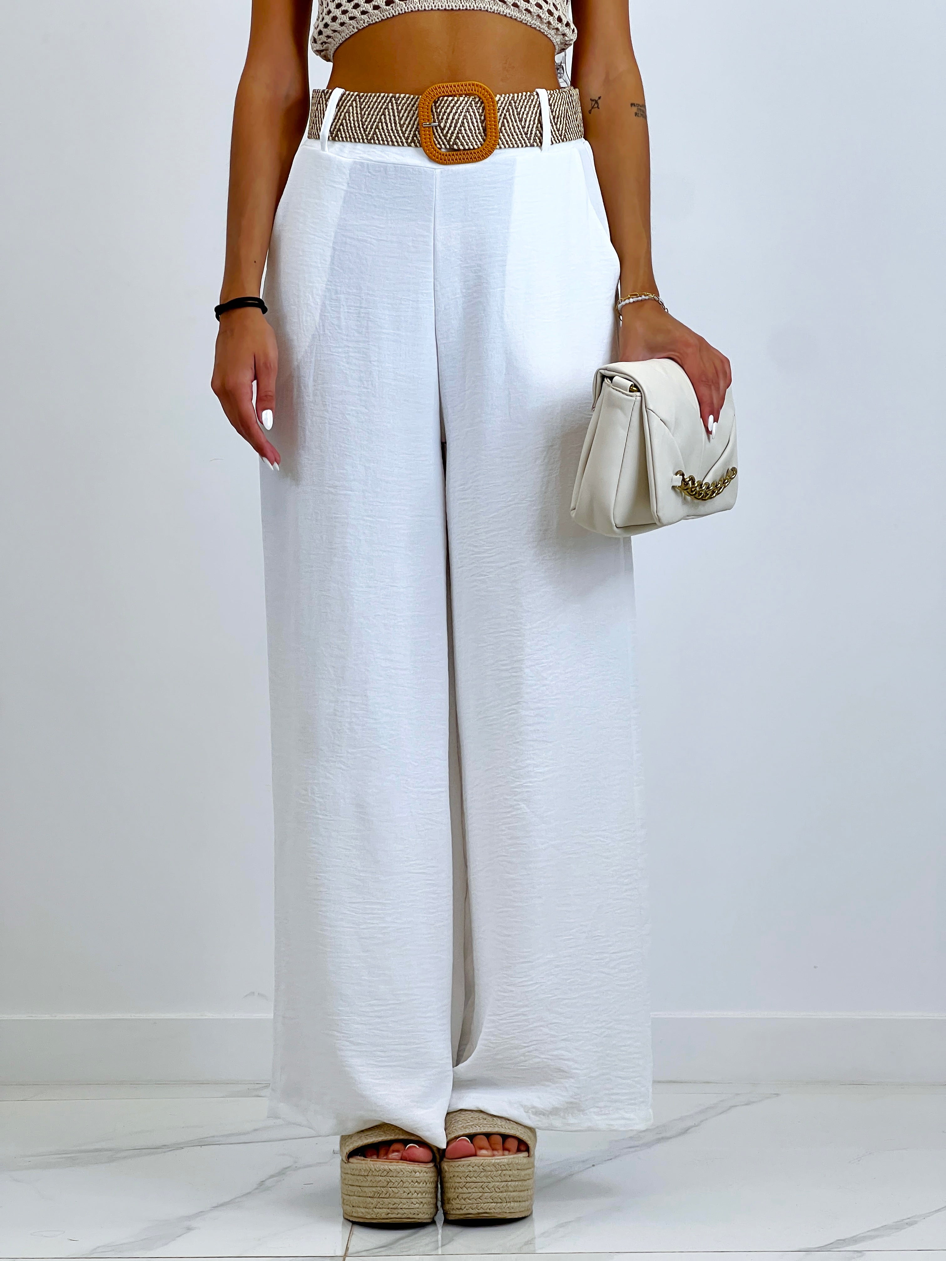 Flowing trousers with raffia belt