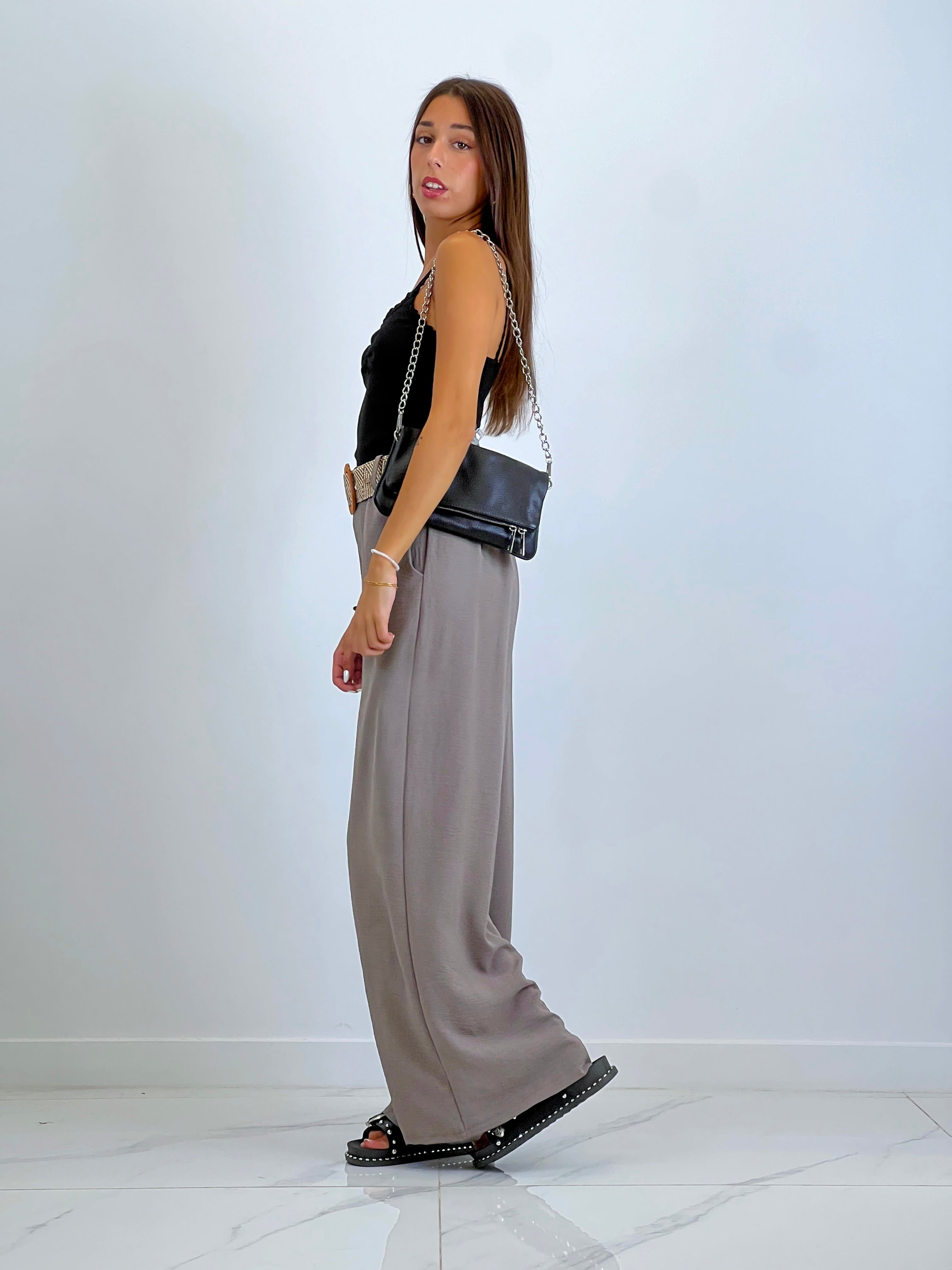 Flowing trousers with raffia belt