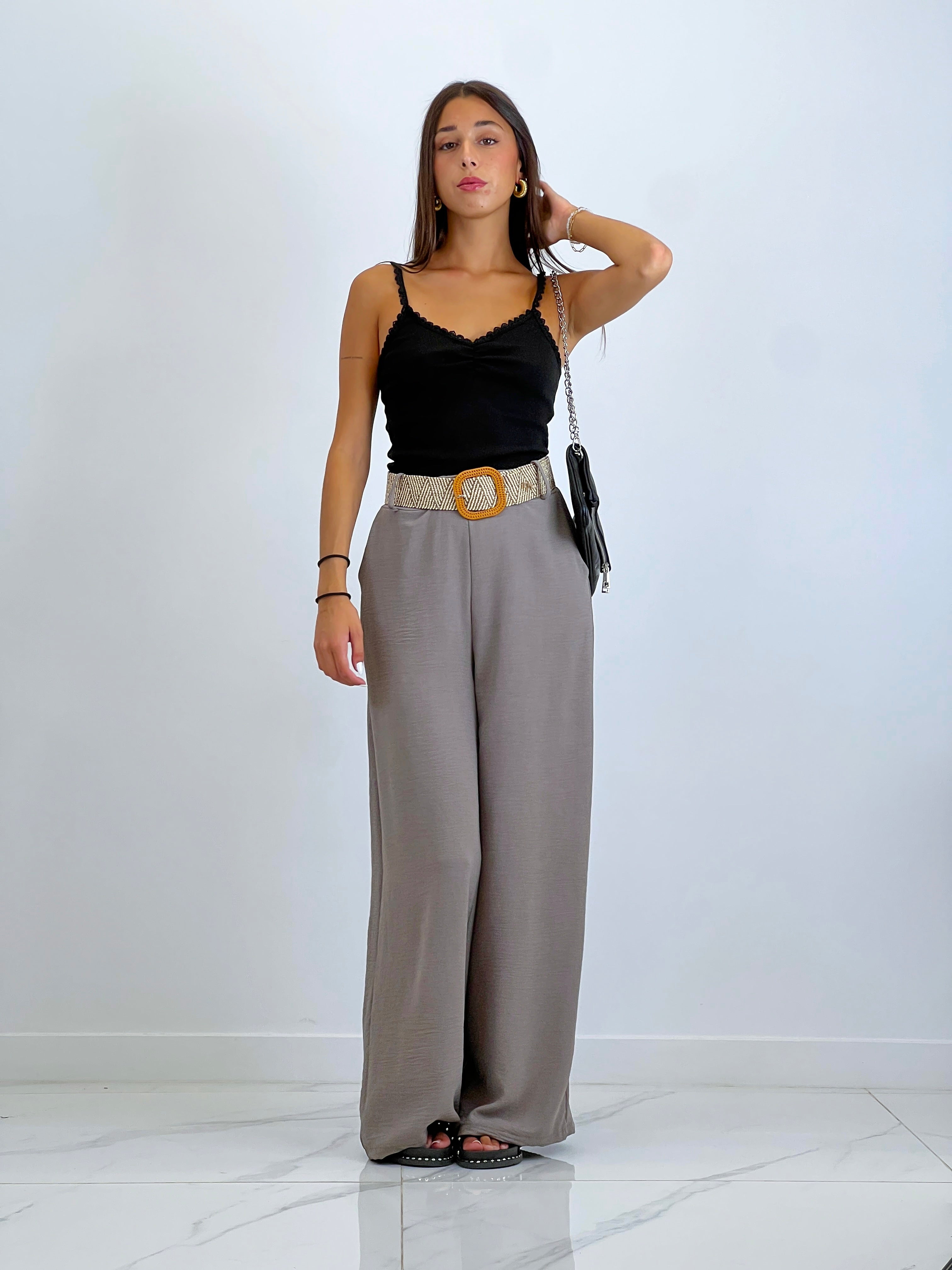 Flowing trousers with raffia belt